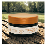Jar of Cannabis Craft Extra Strength Cannabis Salve on a wooden surface with a natural background