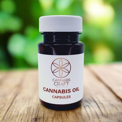 A bottle of Cannabis Oil Capsules with a white label displaying the brand name Cannabis Craft and the product name.